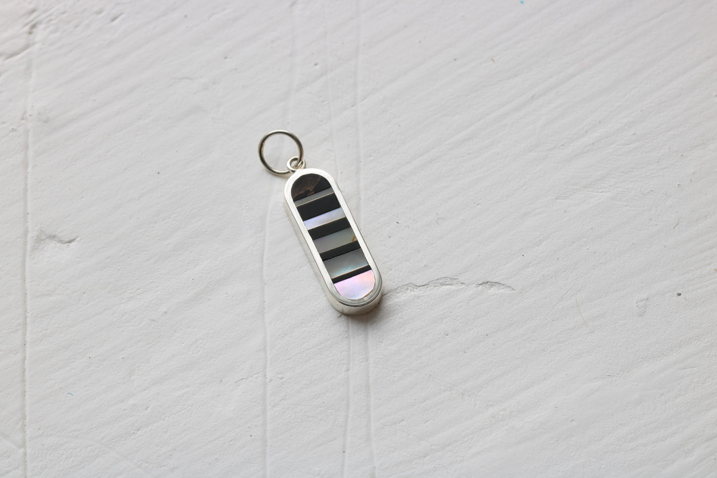 Infinity Charm vertical silver MTO