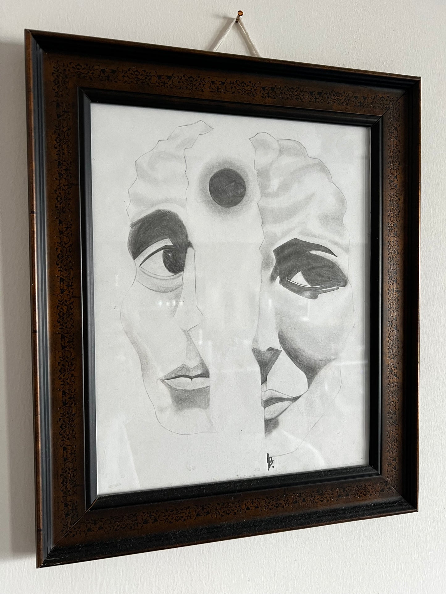 two halves of a face with one brain symbolized by a total eclipse