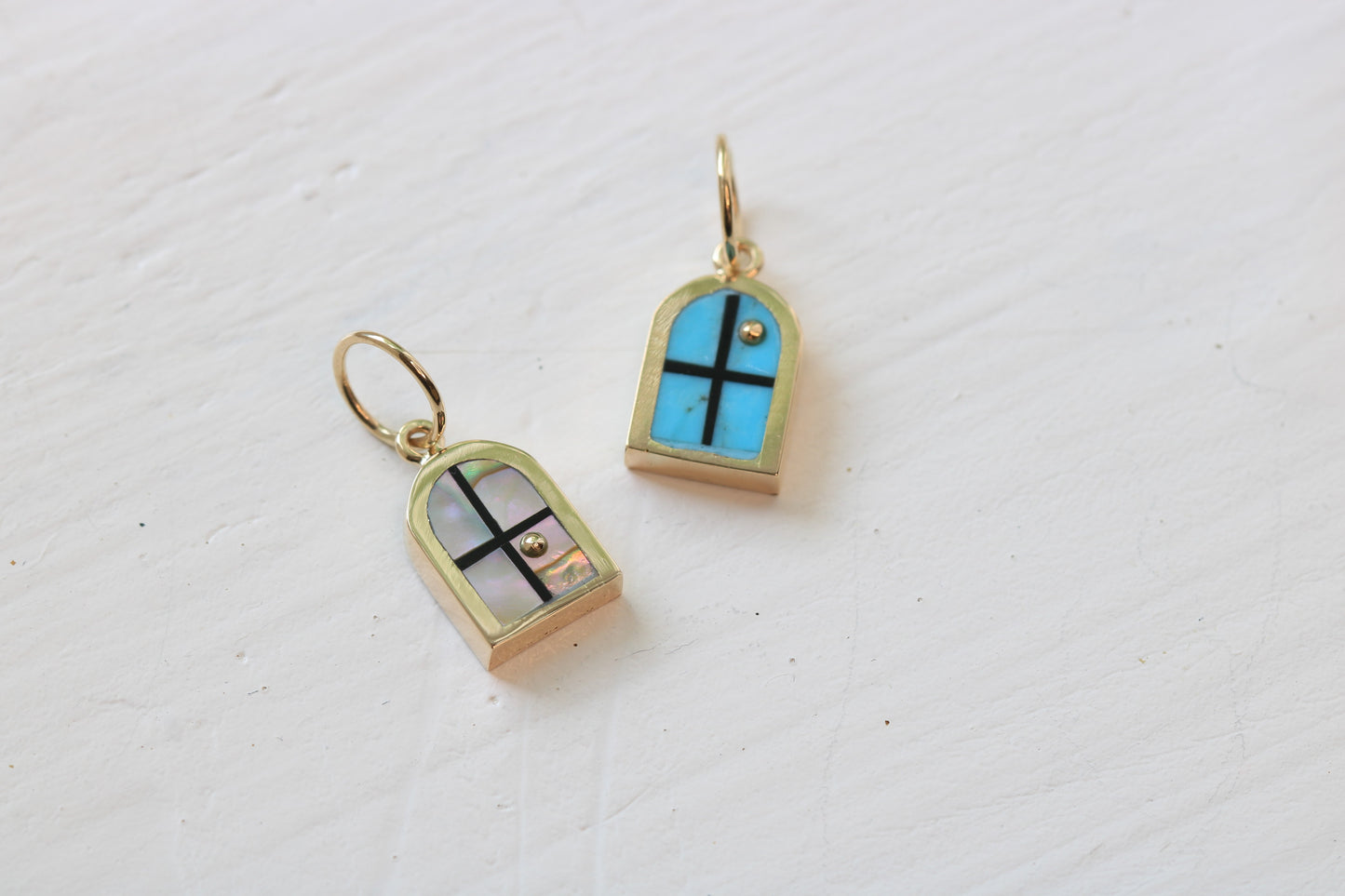 window charms in 14k yellow gold with abalone or Kingman turquoise inlay and a 14k yellow gold sun on white background