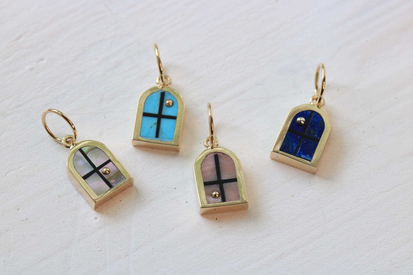 window charm series in 14k gold with abalone, turquoise, Peruvian pink opal, or lapis lazuli on white background