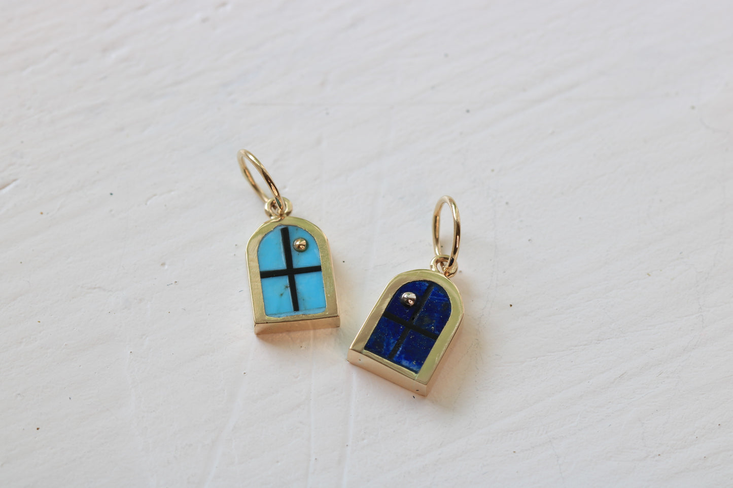 window charms in 14k yellow gold with Kingman turquoise inlay and 14k gold sun or lapis lazuli and sterling silver moon on white background