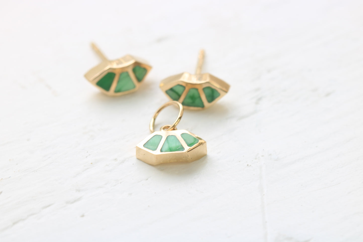14k gold fan earrings and charm inlaid with green variscite on white background