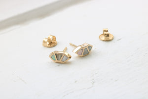 14k yellow gold fan studs with California red abalone inlay on white background