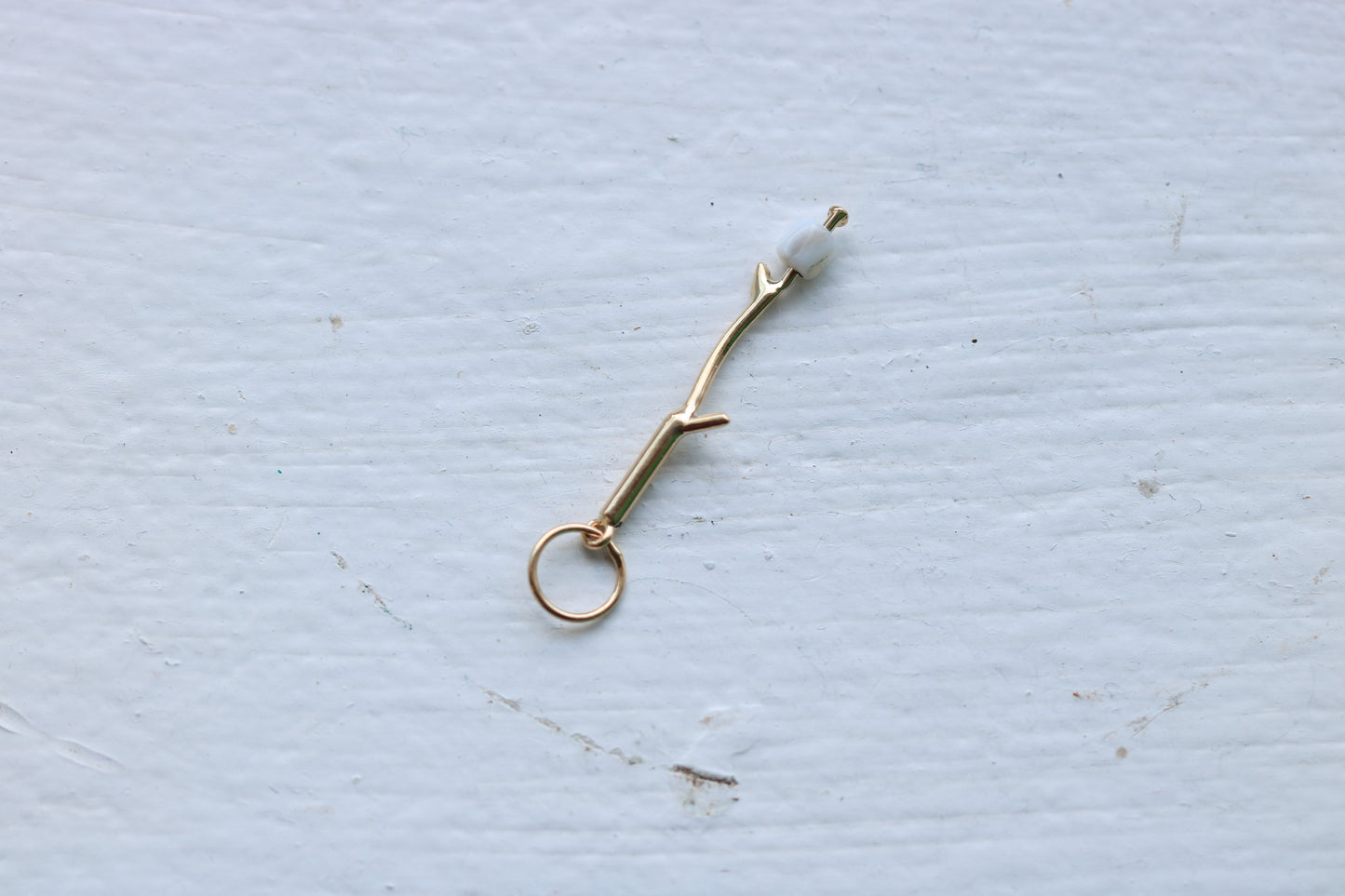 14k yellow gold branch with mother of pearl marshmallow bead