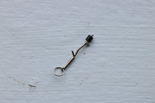 14k white gold branch with one onyx marshmallow bead.