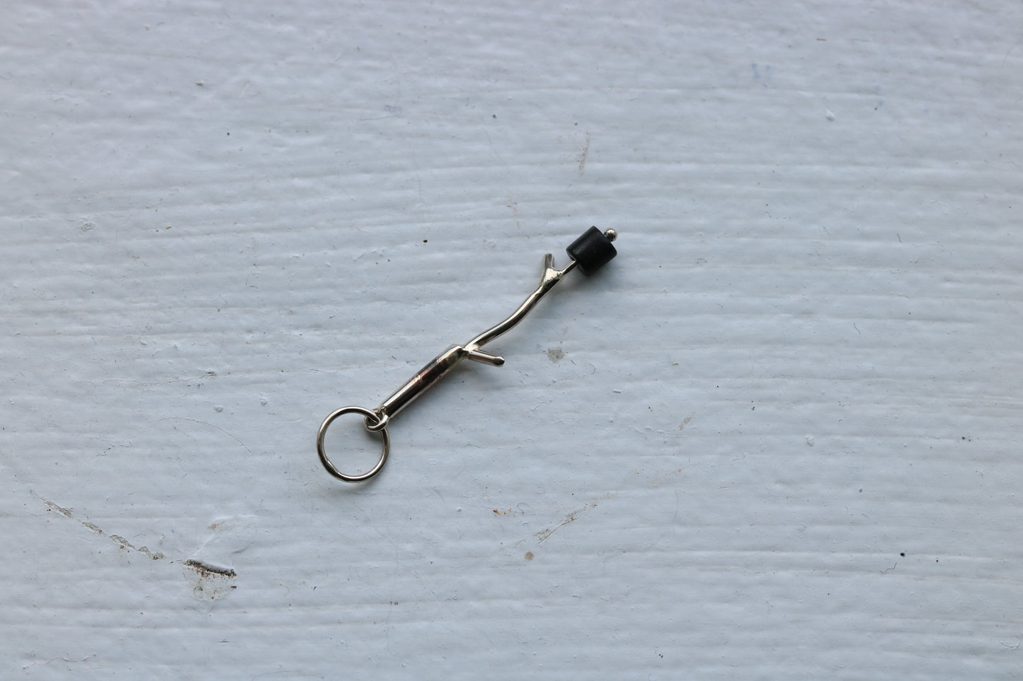 14k white gold branch with onyx marshmallow bead.