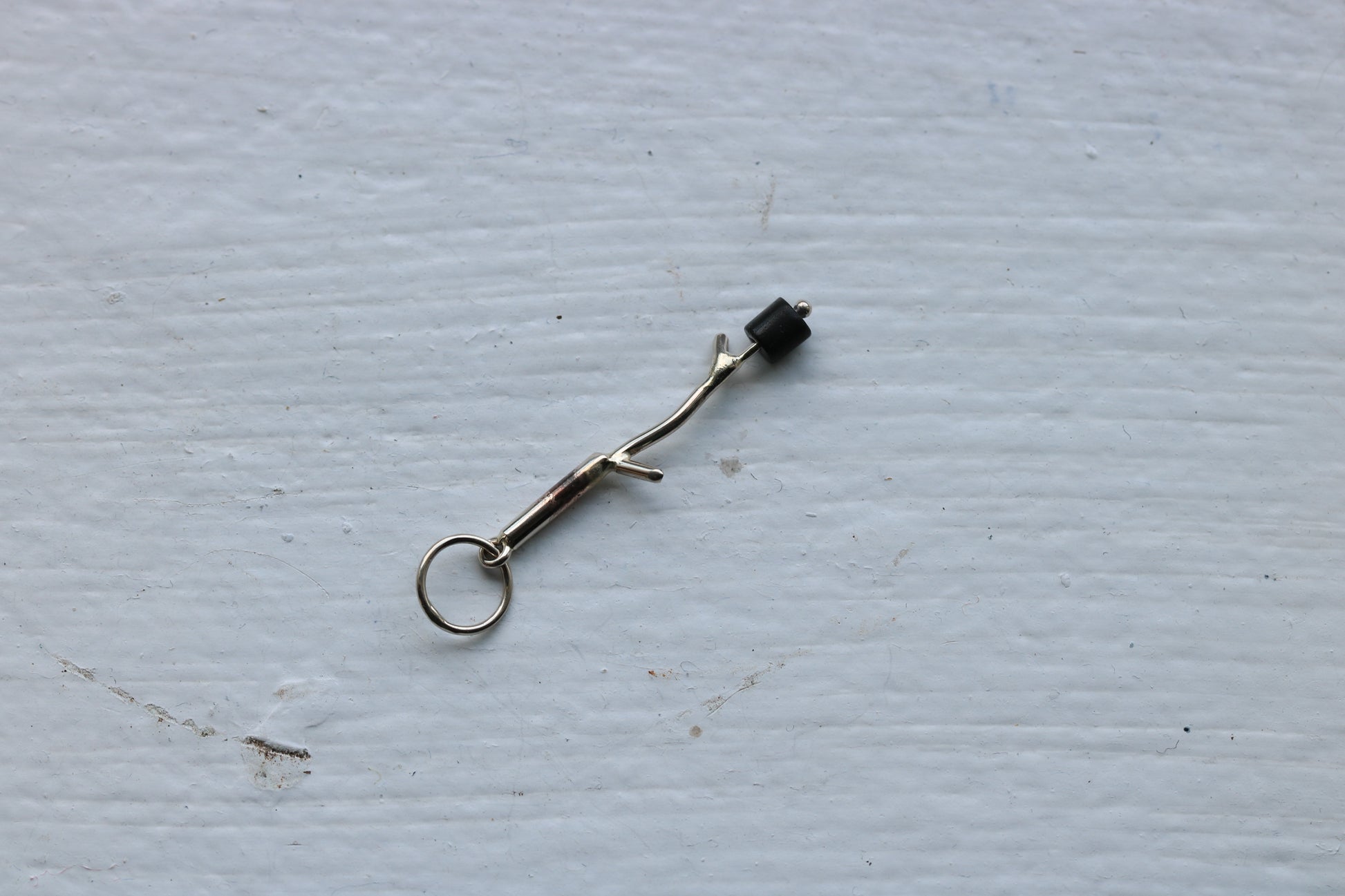 14k white gold branch with onyx marshmallow bead.