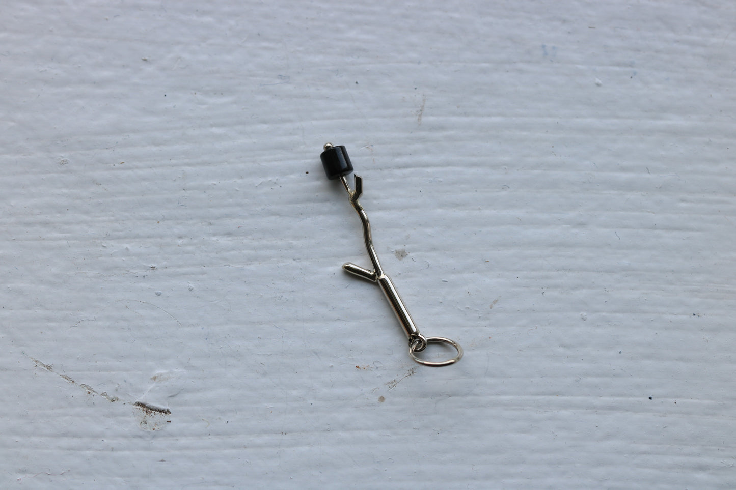 14k white gold branch with onyx marshmallow bead.