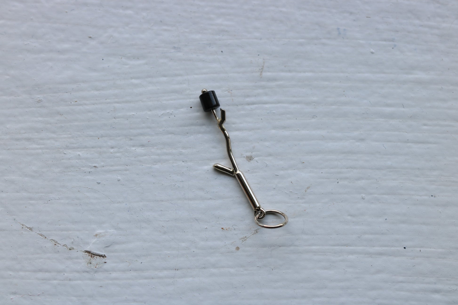 14k white gold branch with onyx marshmallow bead.