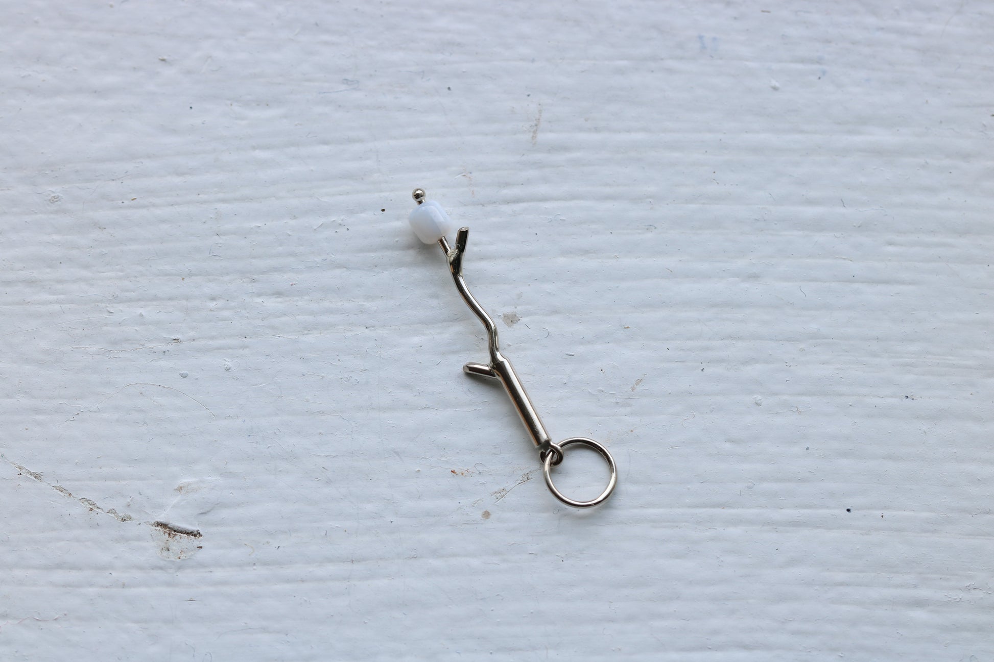 14k white gold branch with mother of pearl marshmallow bead.