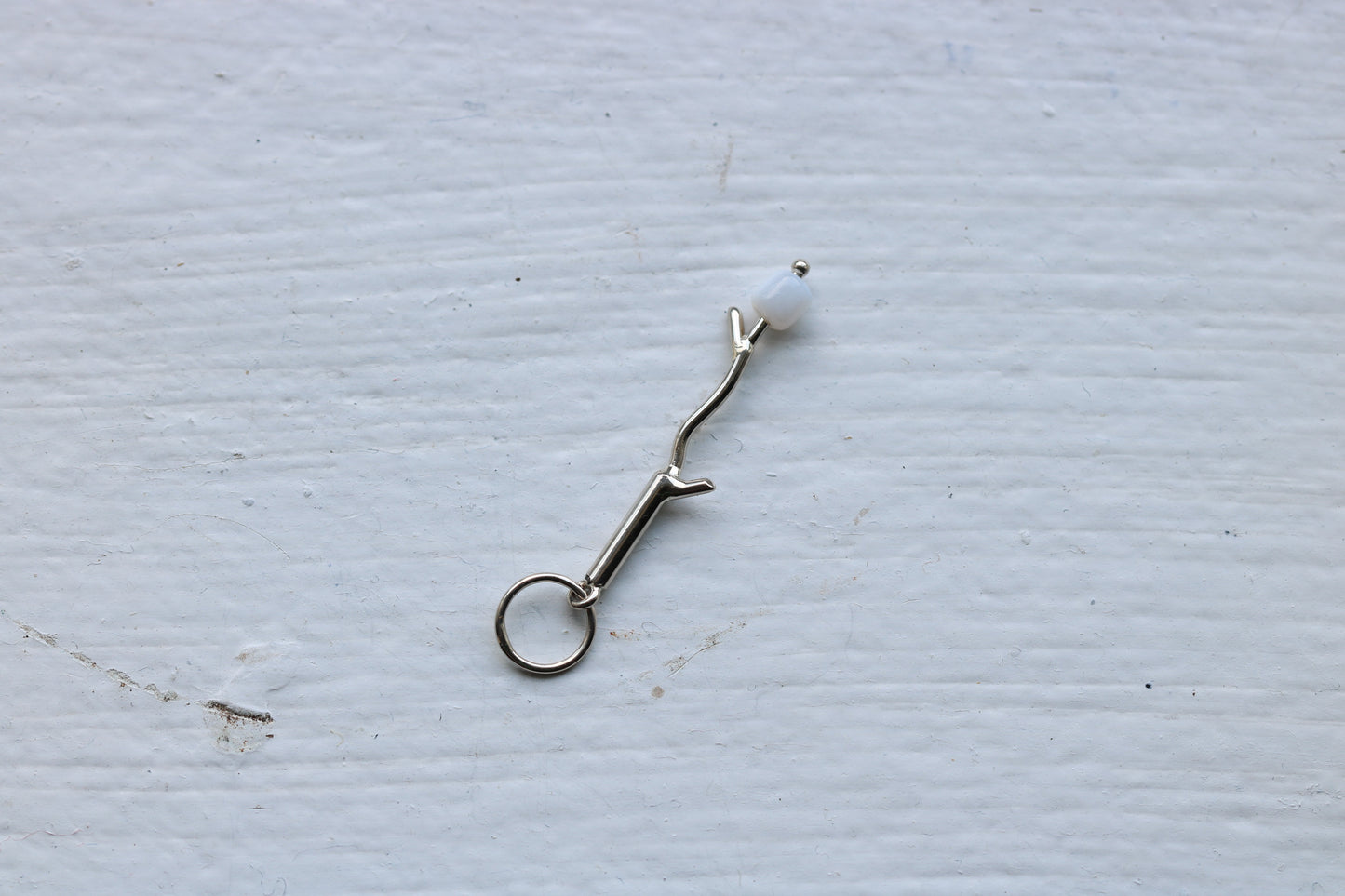 14k white gold branch with mother of pearl marshmallow bead.