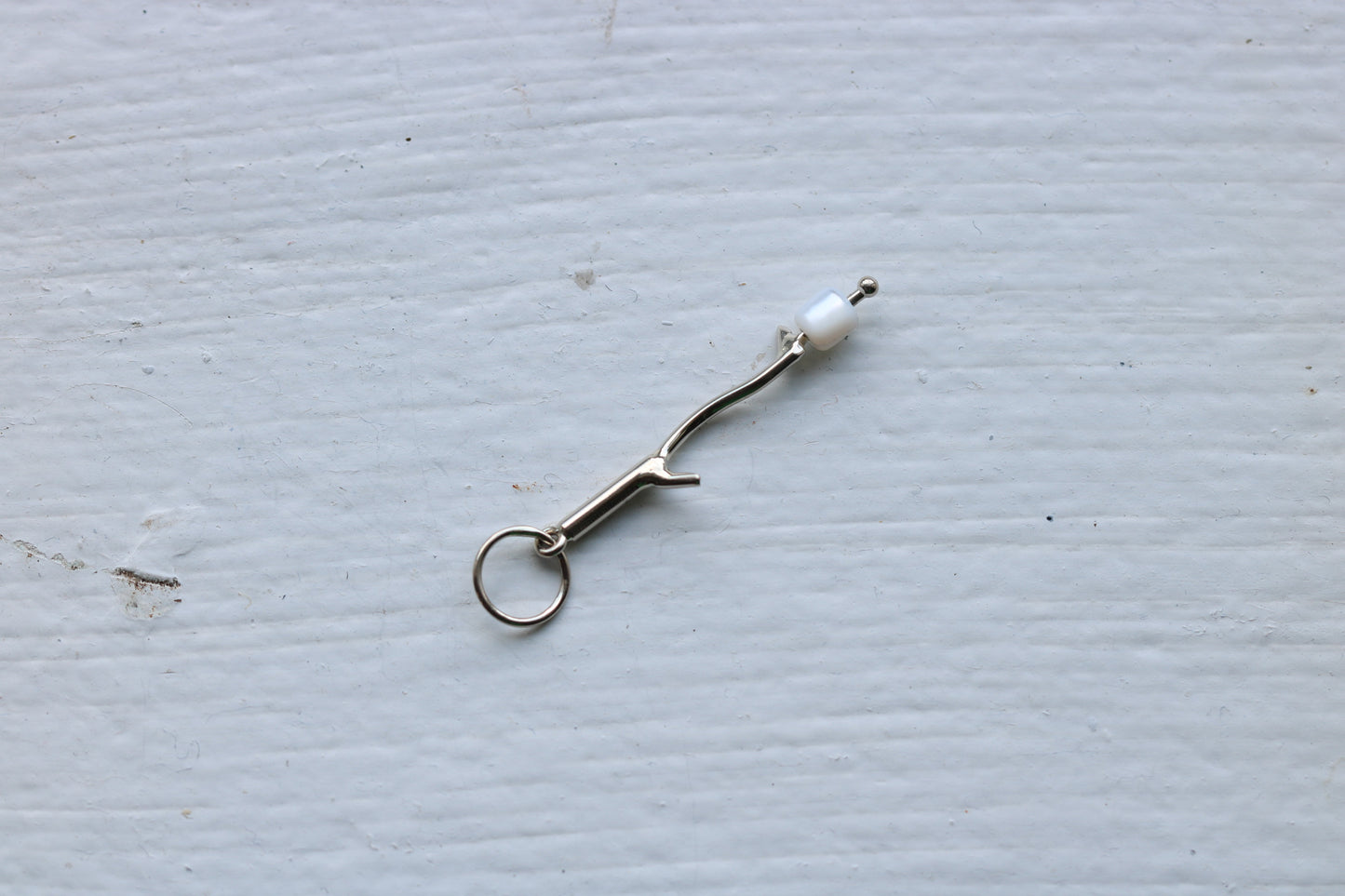 14k white gold branch with mother of pearl marshmallow bead.