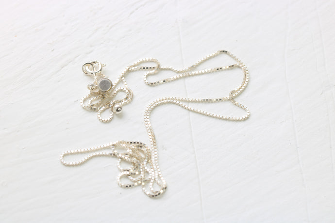 sterling silver box chain on white background