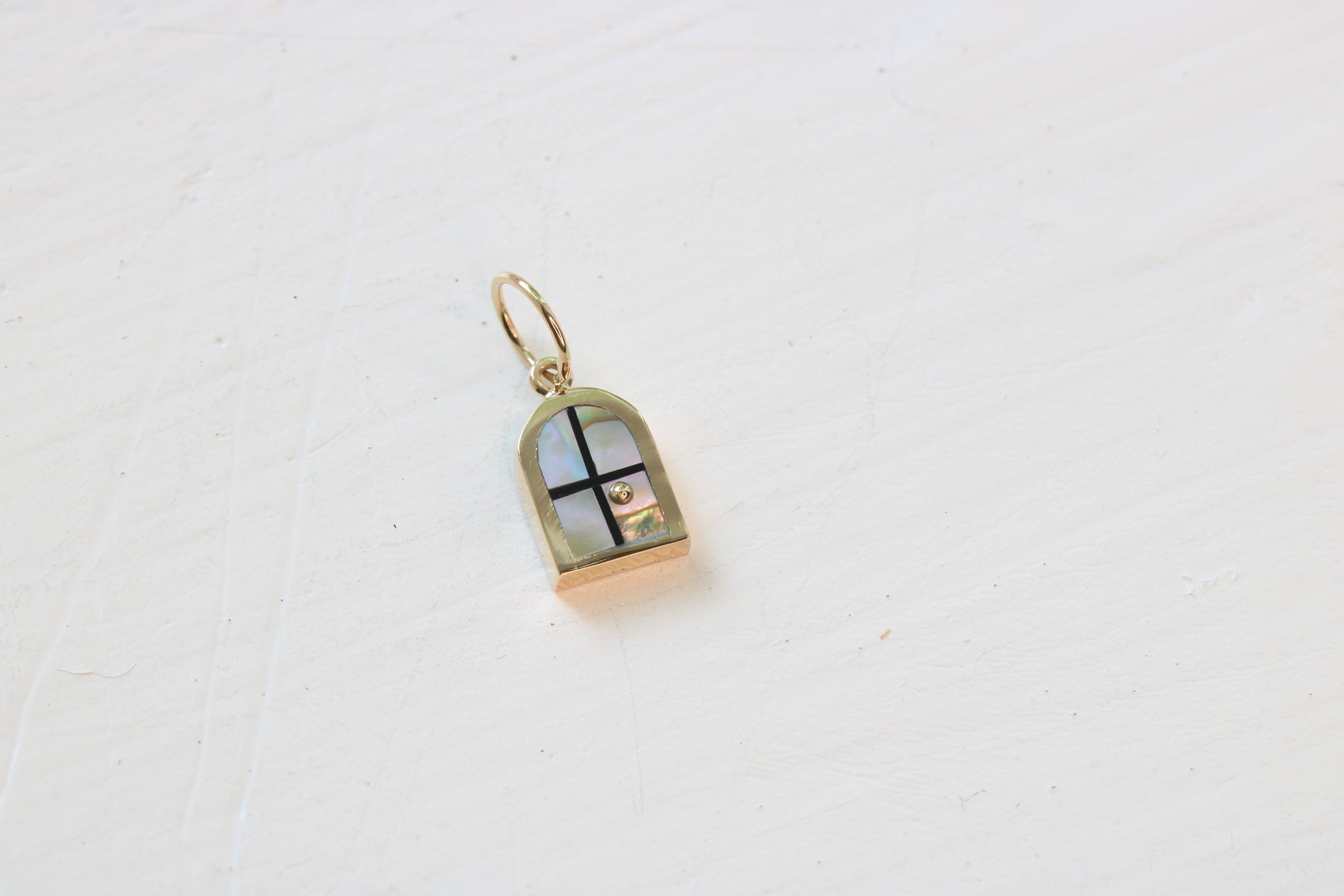 window charm in 14k yellow gold with California abalone inlay and a 14k yellow gold sun