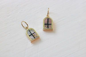 window charms in 14k yellow gold with abalone or Peruvian pink opal and a 14k yellow gold sun on white background