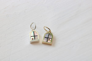 window charms in sterling silver or 14k yellow gold and California red abalone inlay with a 14k yellow gold sun on white background