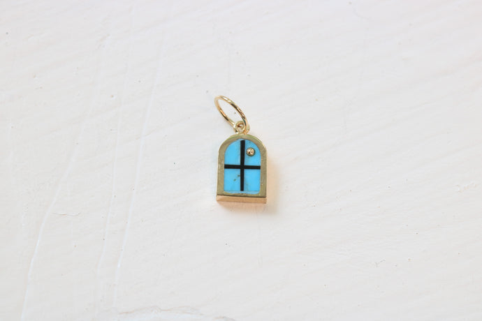 window charm in 14k yellow gold with Kingman turquoise inlay and a 14k yellow gold sun on white background