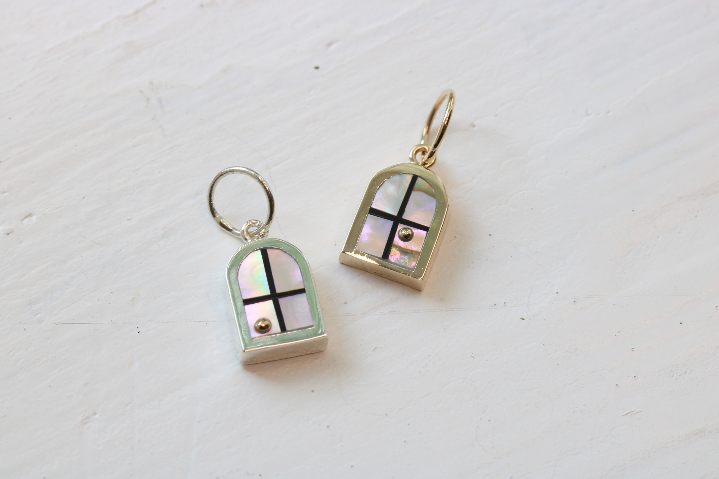 window charms in sterling silver or 14k yellow gold with California red abalone inlay and a 14k yellow gold sun