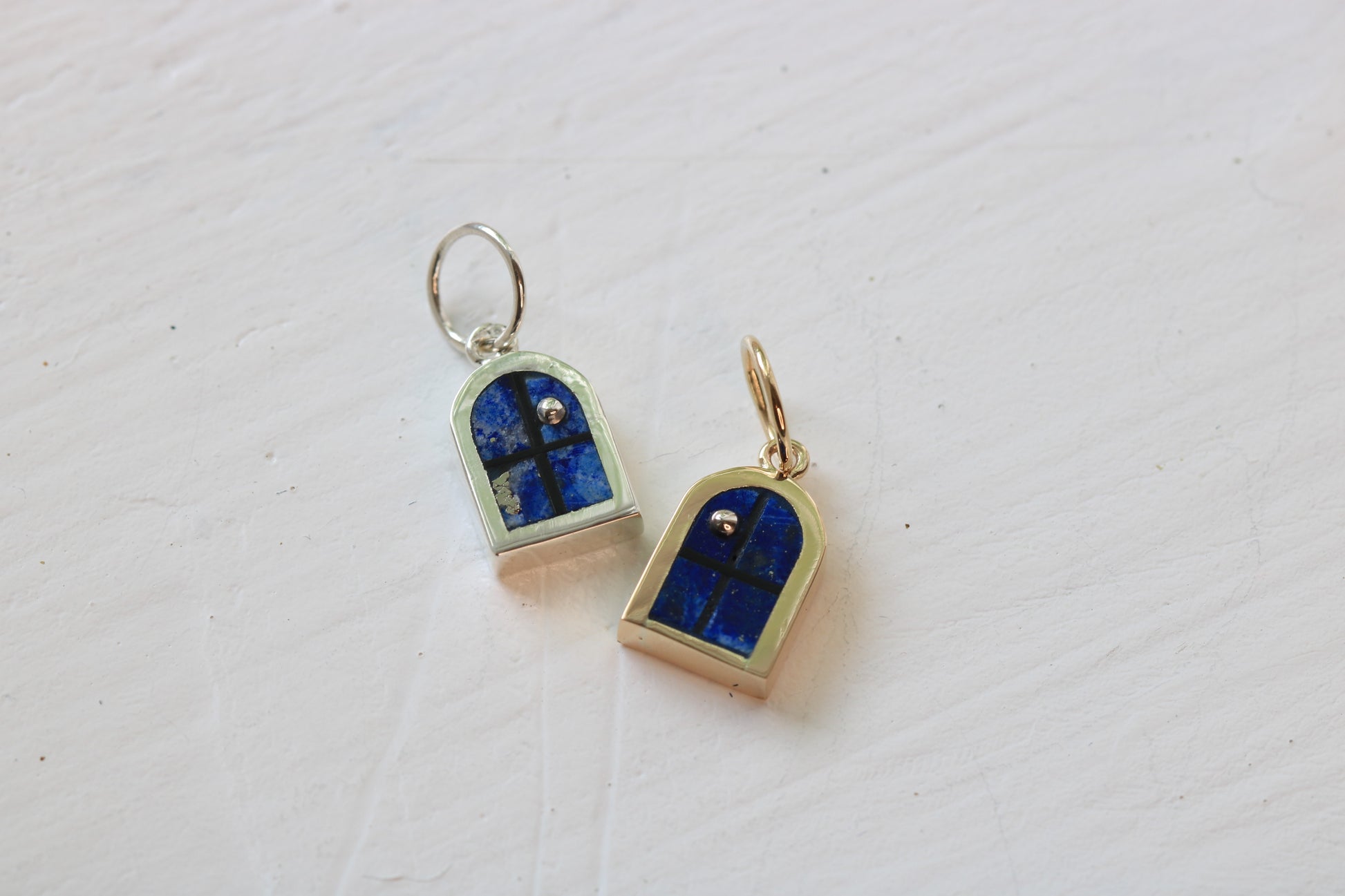 window charm in sterling silver and 14k with lapis lazuli inlay and sterling silver moon on white background