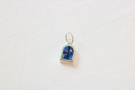 window charm in sterling silver with lapis lazuli inlay on white background