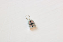 Load image into Gallery viewer, silver window charm on table with pink opal inlay and 14k gold sun
